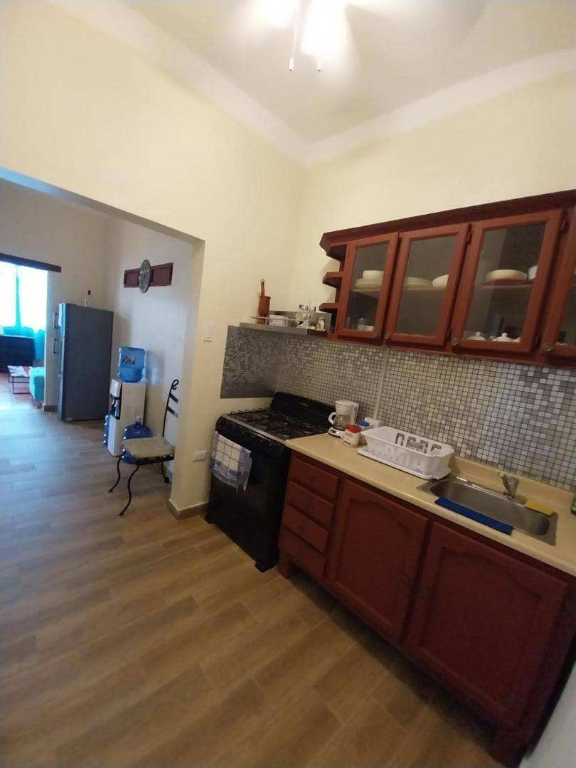 Private kitchen with wooden cabinets and a stove